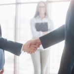Business people shaking hands, finishing up a meeting