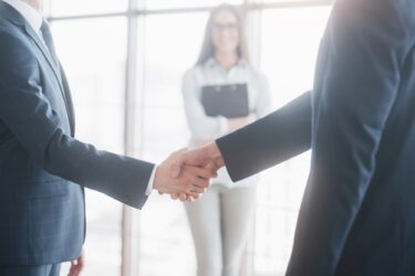 Business people shaking hands, finishing up a meeting